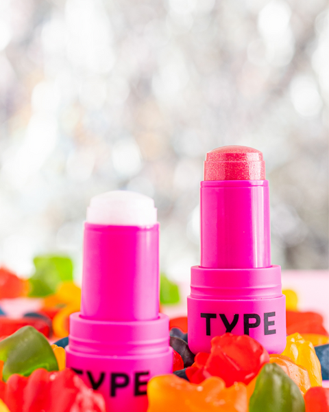 GET EVEN HYDRA JELLY TINT in vibrant pink packaging surrounded by colorful candy.