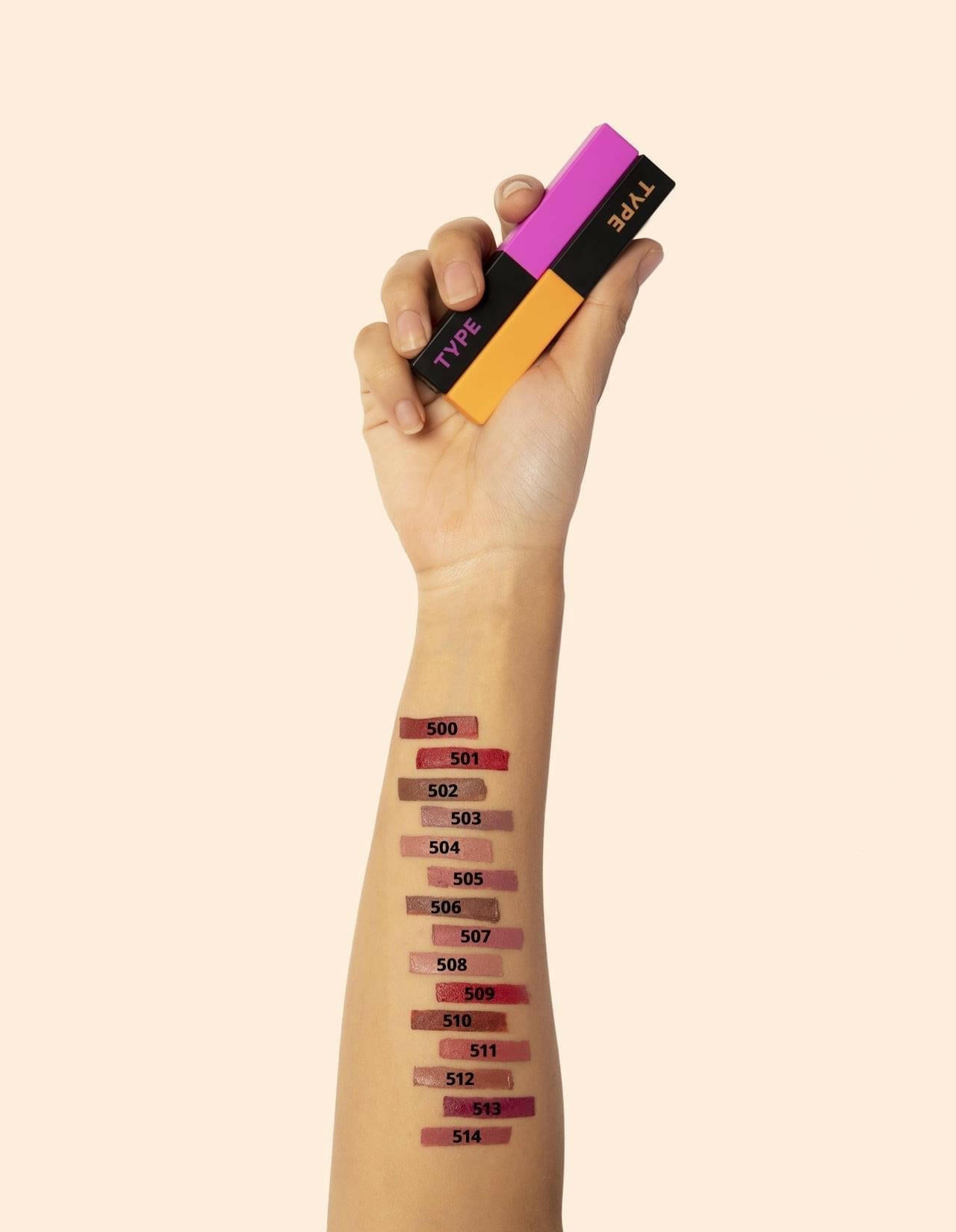 Light Up Lipstick shades swatched on arm with packaging in hand.